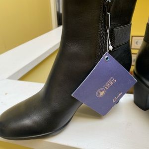 Clark’s brand women’s waterproof heeled boots — black. Super comfortable. NWT.